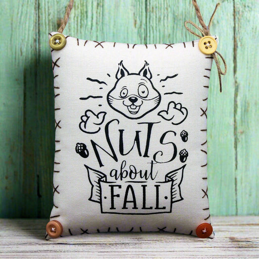 Decorative mini  pillow sign with an image of an enthusiastic squirrel who is 'nuts about fall'