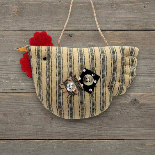 Striped chicken-shaped wall ornament with decorative elements on a wooden surface