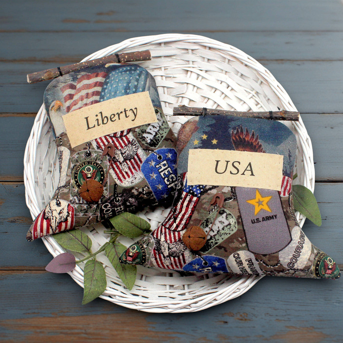 Set of two primitive fabric Liberty Bell ornaments with labels reading Liberty and USA