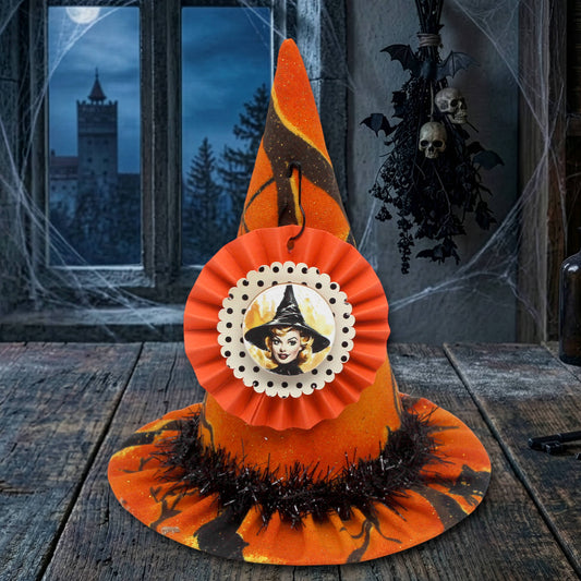 Halloween-themed hat with decorative elements on a wooden surface.