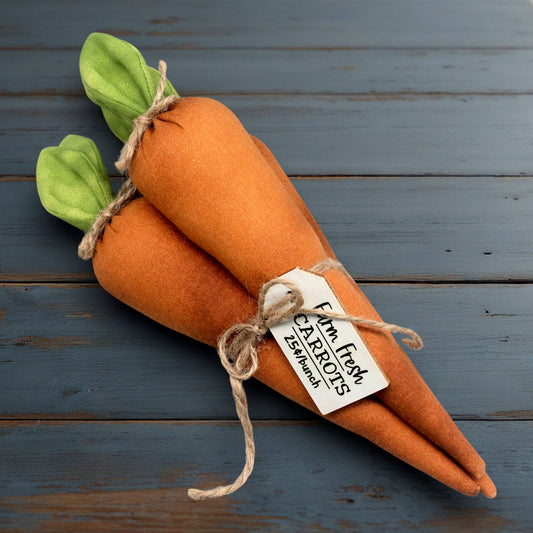 Bundle of fabric carrots tied up with jute twine and a wooden tag