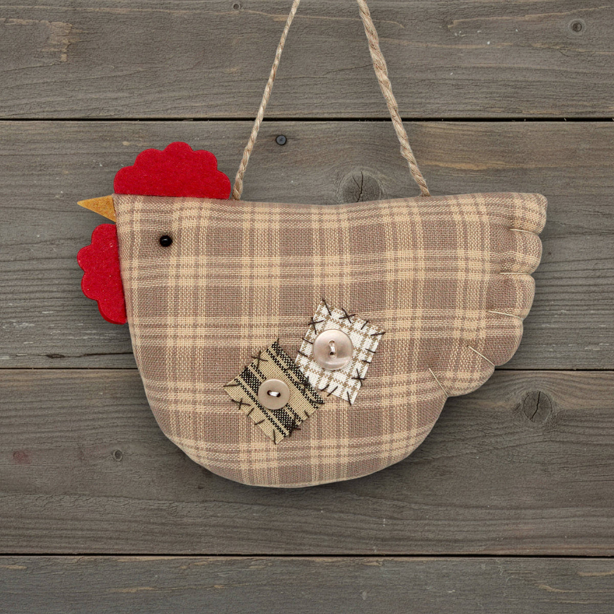 Plaid chicken ornament with decorative elements on a wooden background