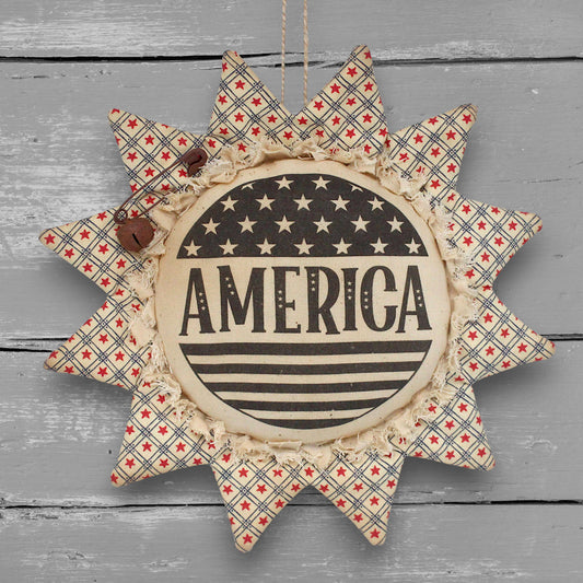 Primitive patriotic handmade fabric sunflower ornament with a printed center that reads "America" along with stars and stripes