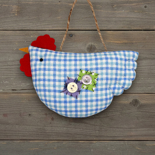 Decorative chicken ornament with blue checkered pattern on a wooden background
