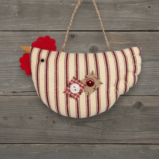 striped fabric chicken ornament with buttons on a wooden background