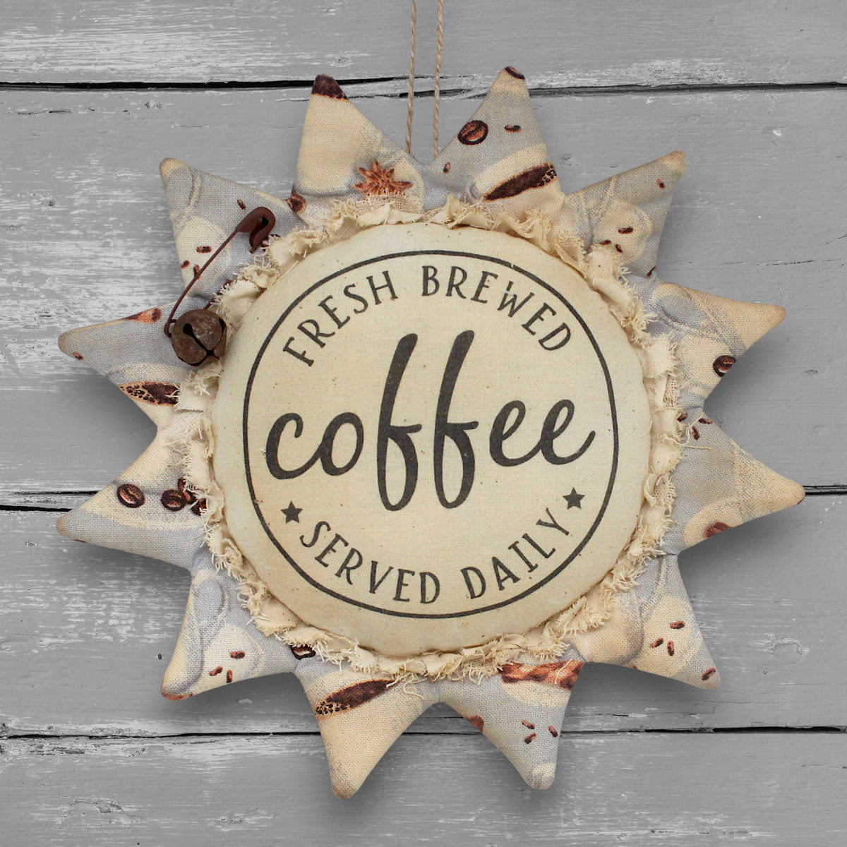 Primitive handmade fabric sunflower ornament with a printed center that advertises for freshly brewed coffee daily.