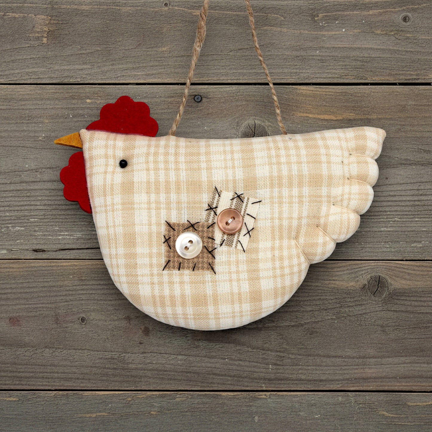 Decorative chicken ornament on a wooden background