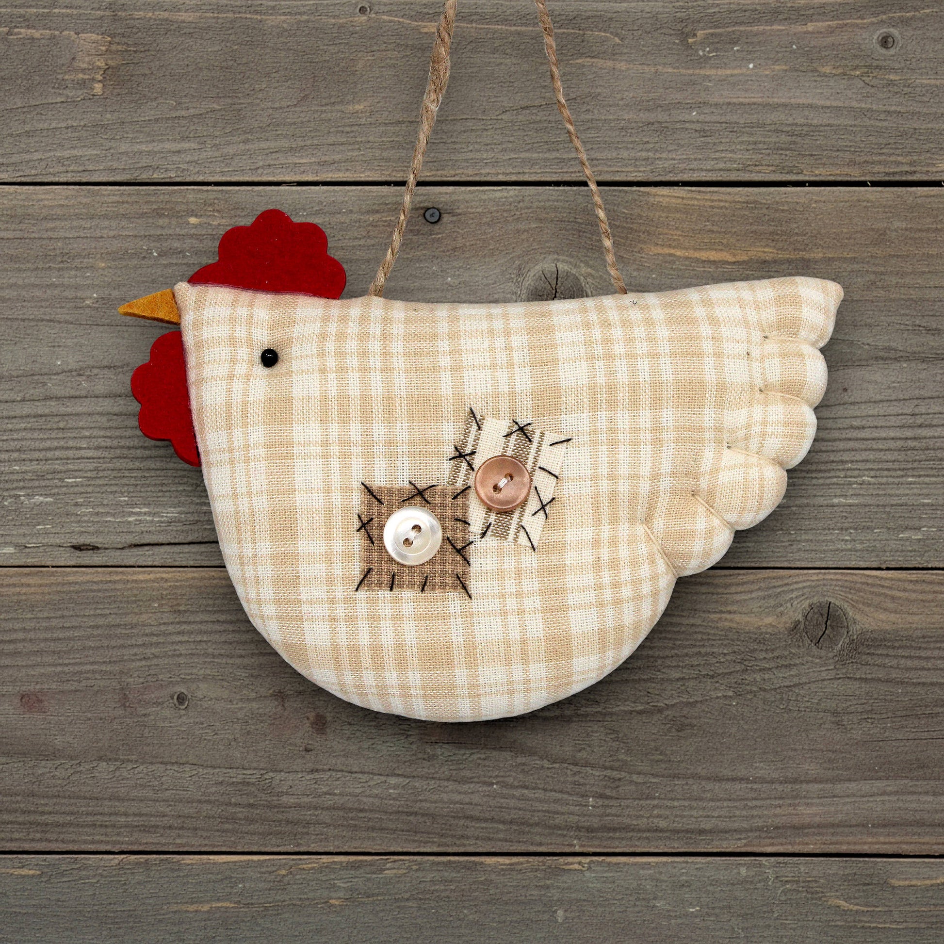Decorative chicken ornament on a wooden background
