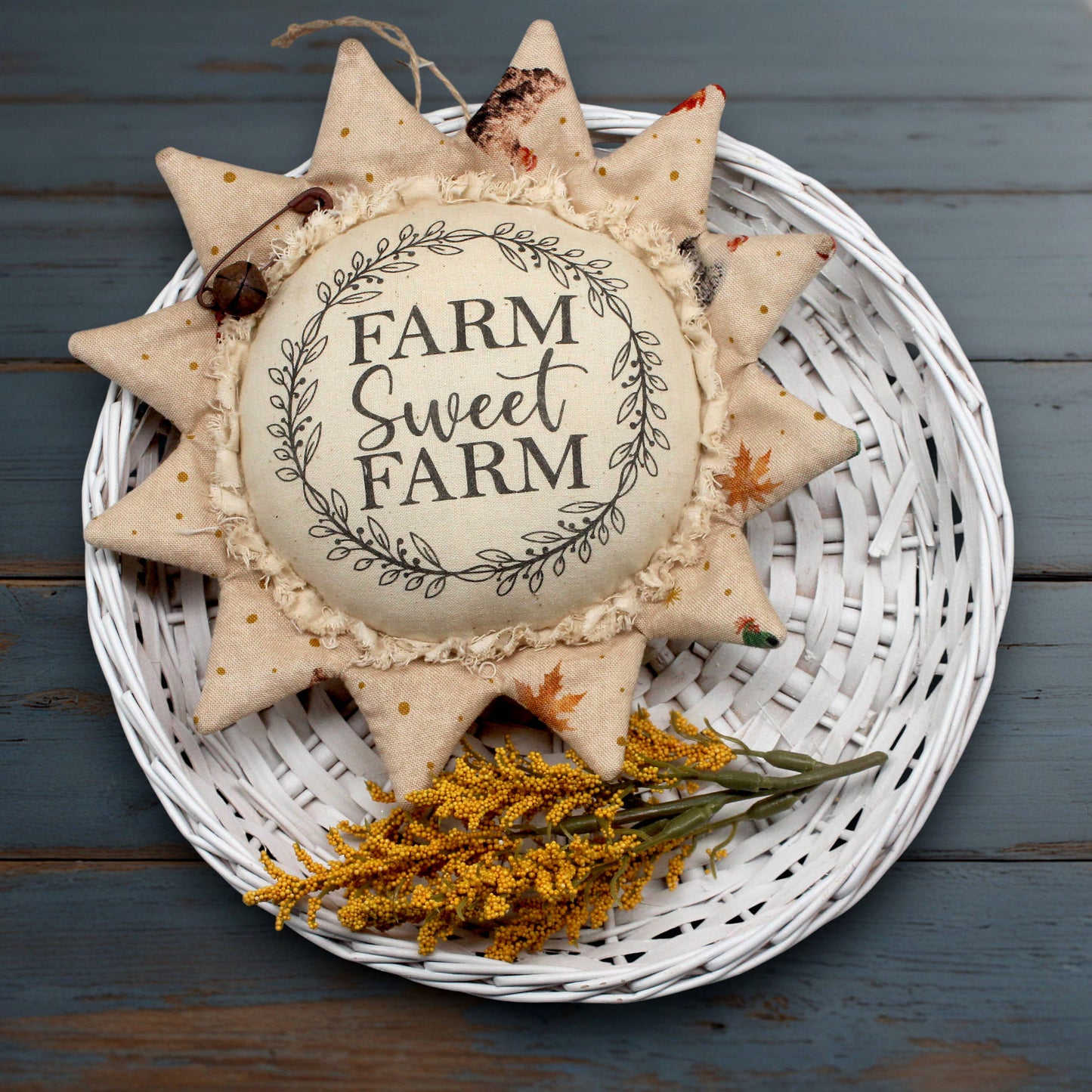 Decorative fabric sunflower sign with 'Farm Sweet Farm' text on a white background