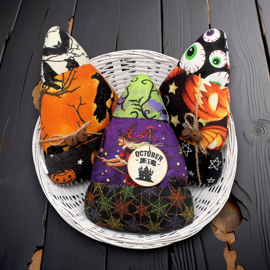 Set of three candy corn bowl fillers made from Halloween print fabrics