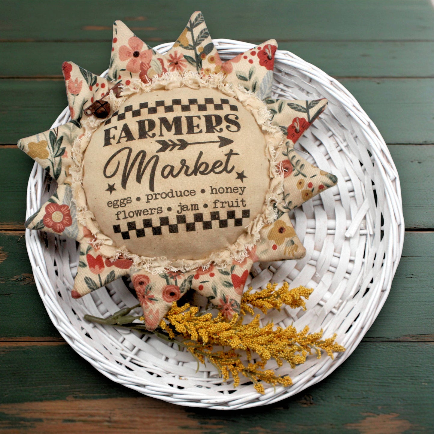 Primitive fabric sunflower ornament featuring an advertisement for a farmers market