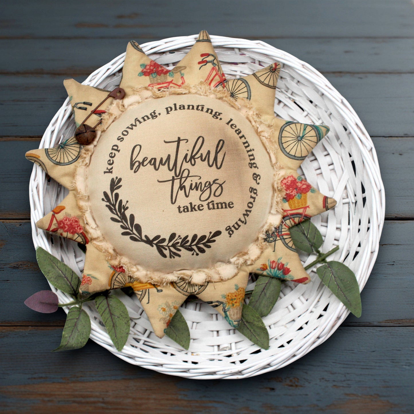 Primitive sunflower ornament with the motivational quote 'Beautiful things take time'