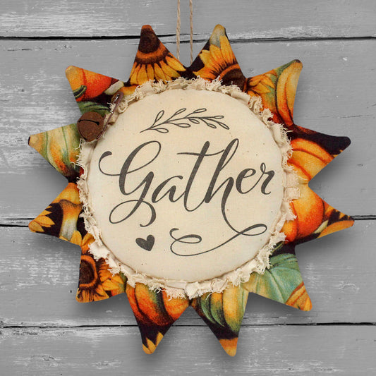 Primitive handmade fabric sunflower ornament or bowl filler with a printed center that reads "Gather"