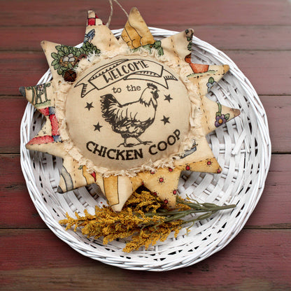 Primitive fabric sunflower ornament that reads 'welcome to the chicken coop'
