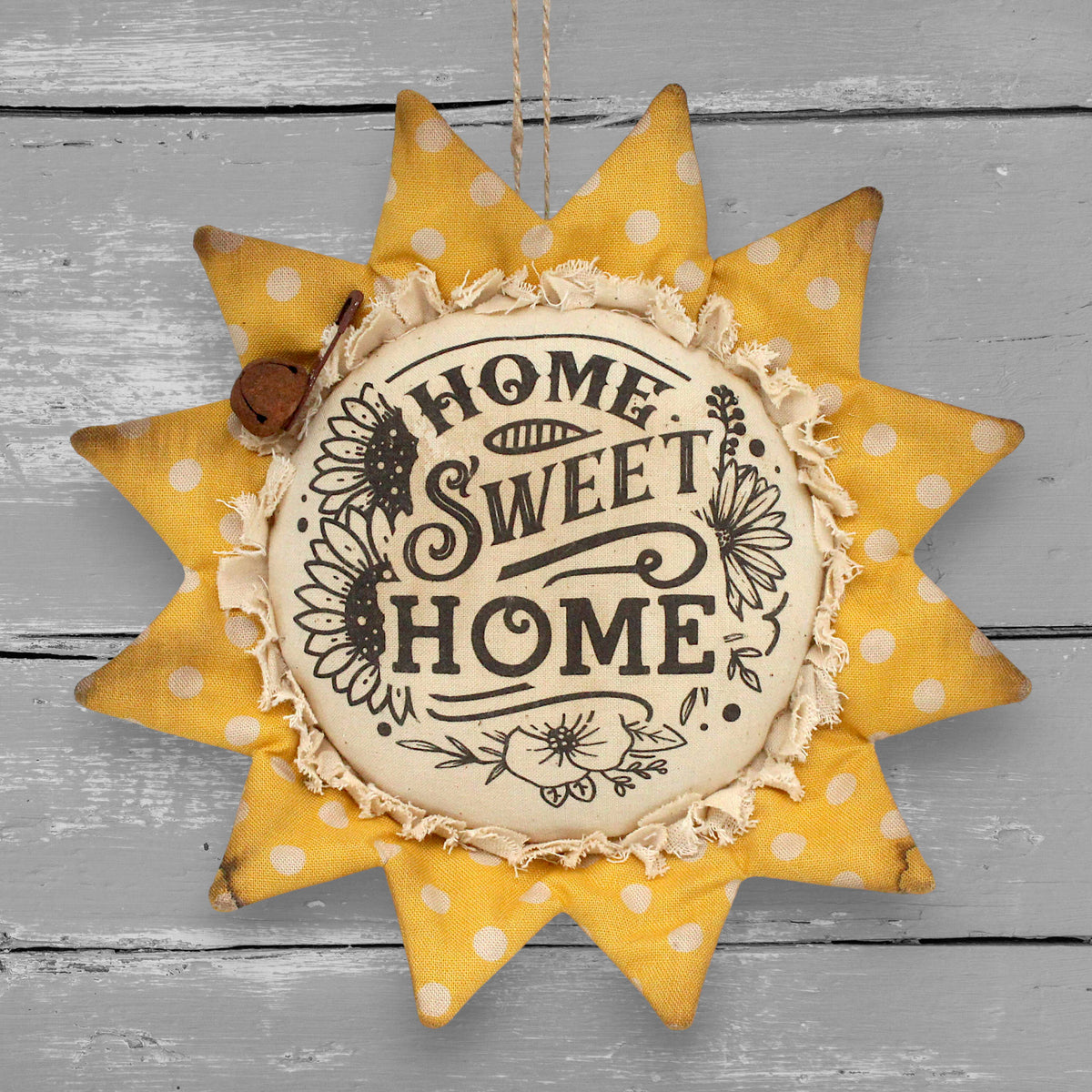 Primitive handmade fabric sunflower ornament with a printed center that reads "Home Sweet Home"