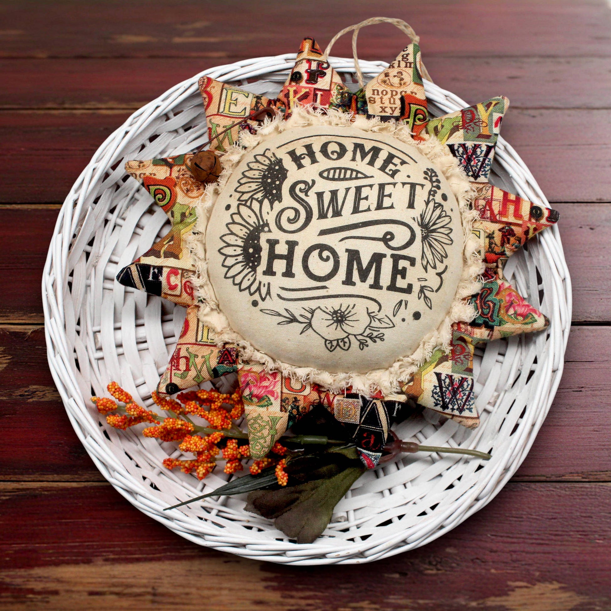 Primitive fabric sunflower ornament with Home Sweet Home printed on its center