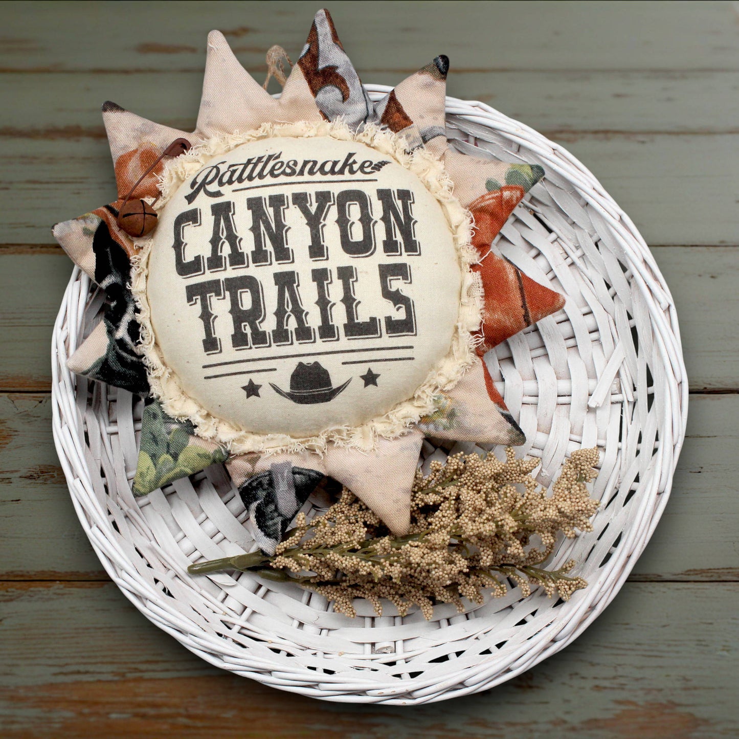 Western style fabric sunflower ornament with an advertisement for Canyon Trails