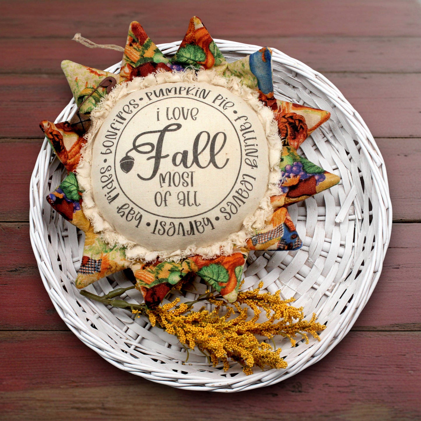 Primitive sunflower ornament with the text 'I love fall most of all'