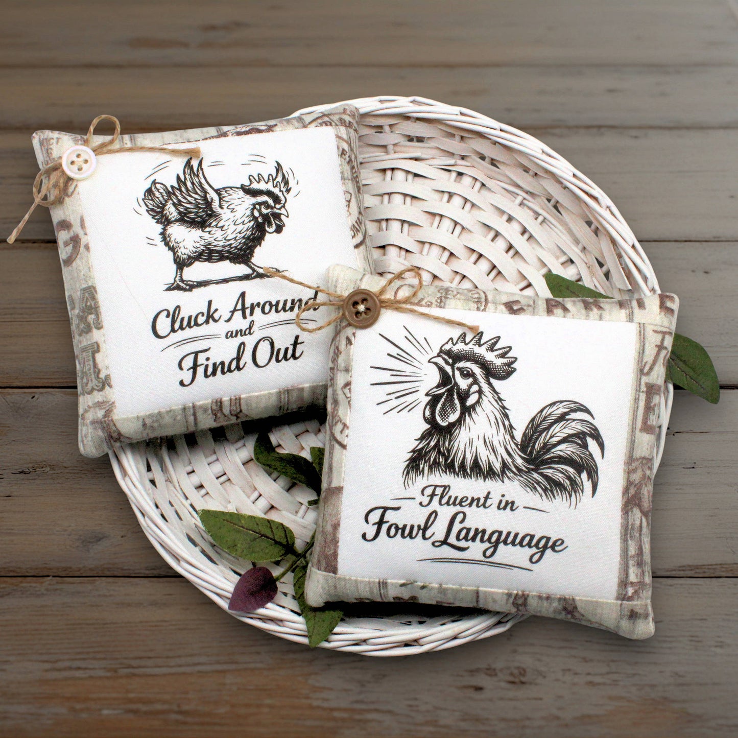 Set of two mini pillow bowl fillers featuring wise-cracking chickens or roosters with humorous messaging displayed in a white basket on a wooden table
