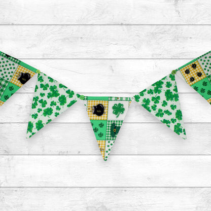 a fabric bunting banner made with alternating saint patrick's day print fabrics