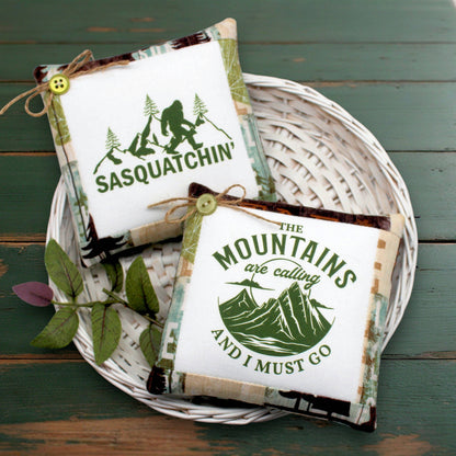 Set of two mini pillow bowl fillers featuring Sasquatch and love for the mountains