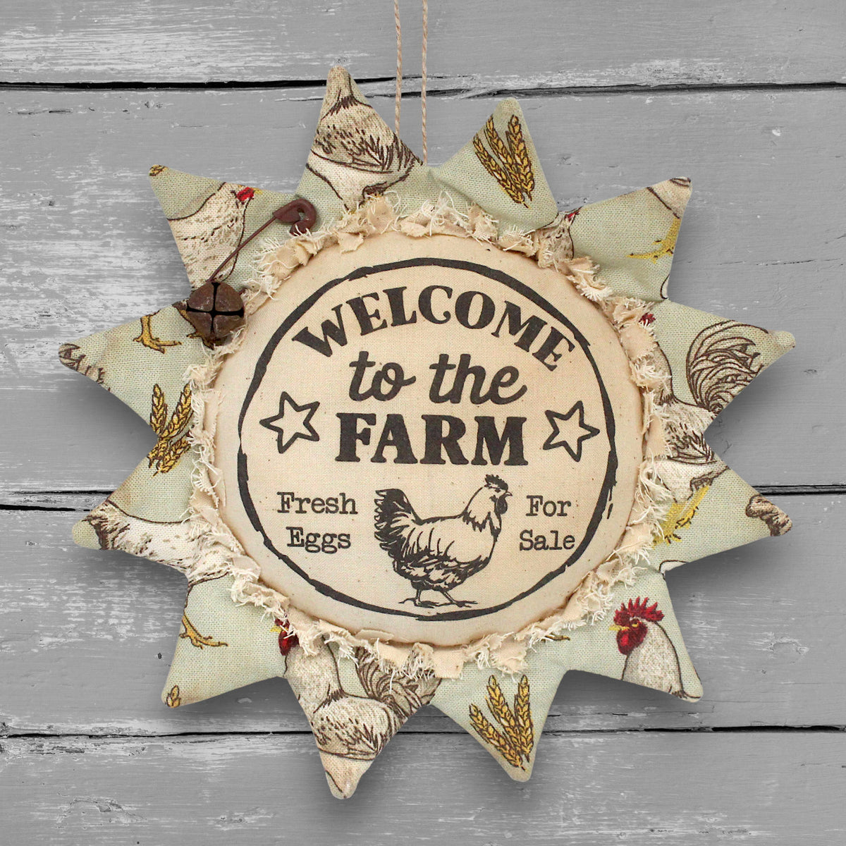 Primitive handmade fabric sunflower ornament or bowl filler with a printed center that reads "welcome to the farm."