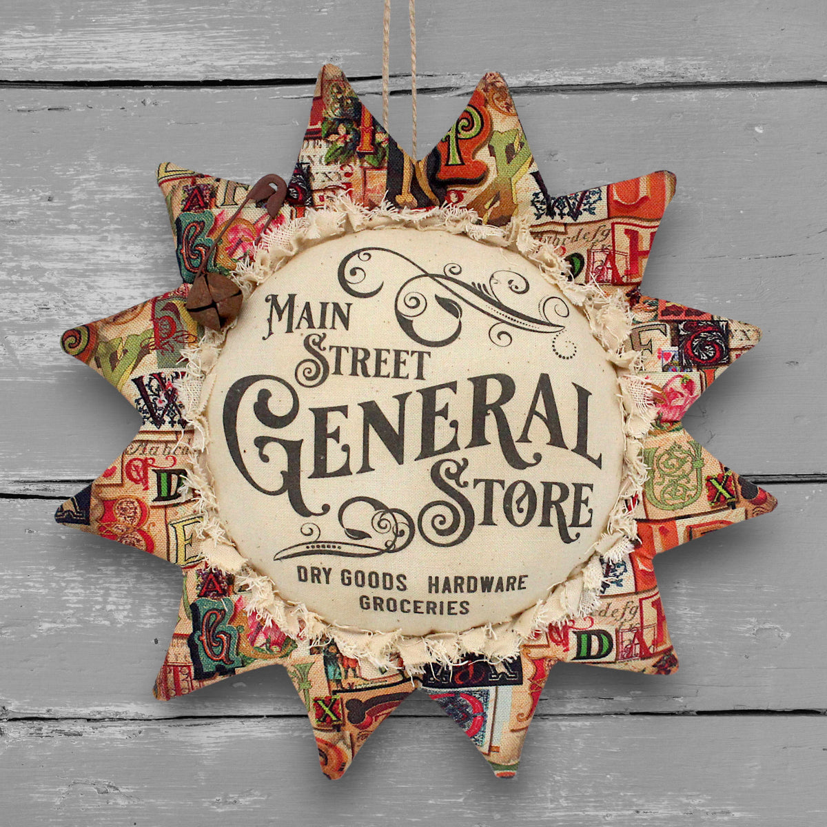Primitive handmade fabric sunflower ornament or bowl filler with a printed center that advertises for the Main Street General Store.