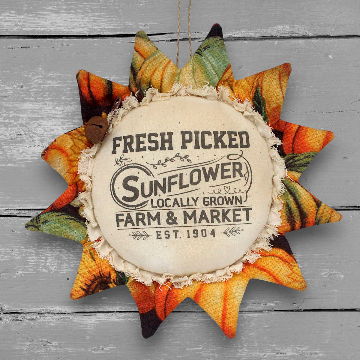 Primitive handmade fabric sunflower ornament or bowl filler with a printed center that advertises for a local farm and market