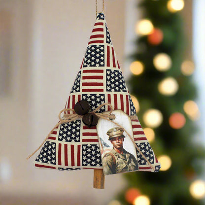 Decorative tree-shaped Christmas ornament with American flag pattern and a tag with a soldier
