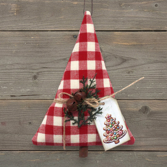 Christmas tree-shaped ornament handmade from red and white homespun fabric with rusty bells and a tag